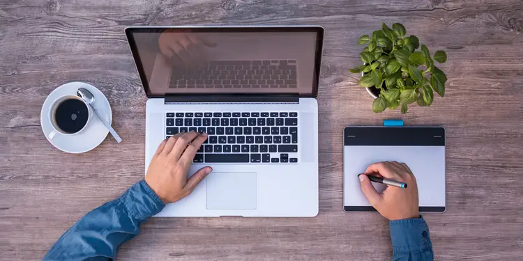 A freelancer taking notes from a laptop