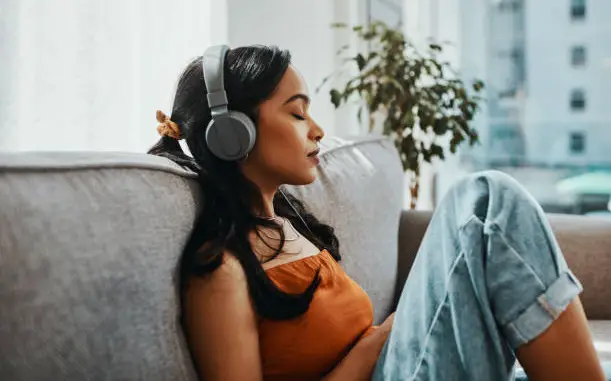 A young lady wearing a headphone
